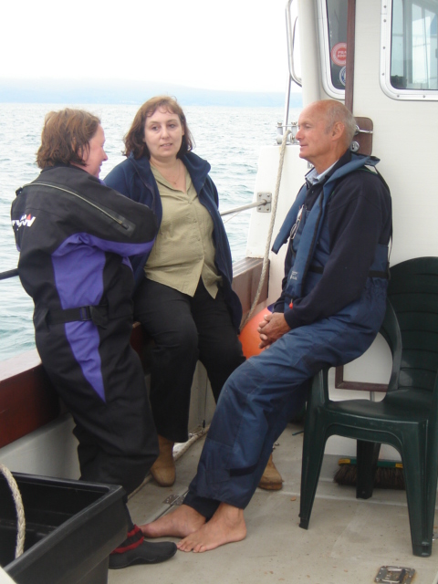Sue, Deanna & Tony discussing the site
